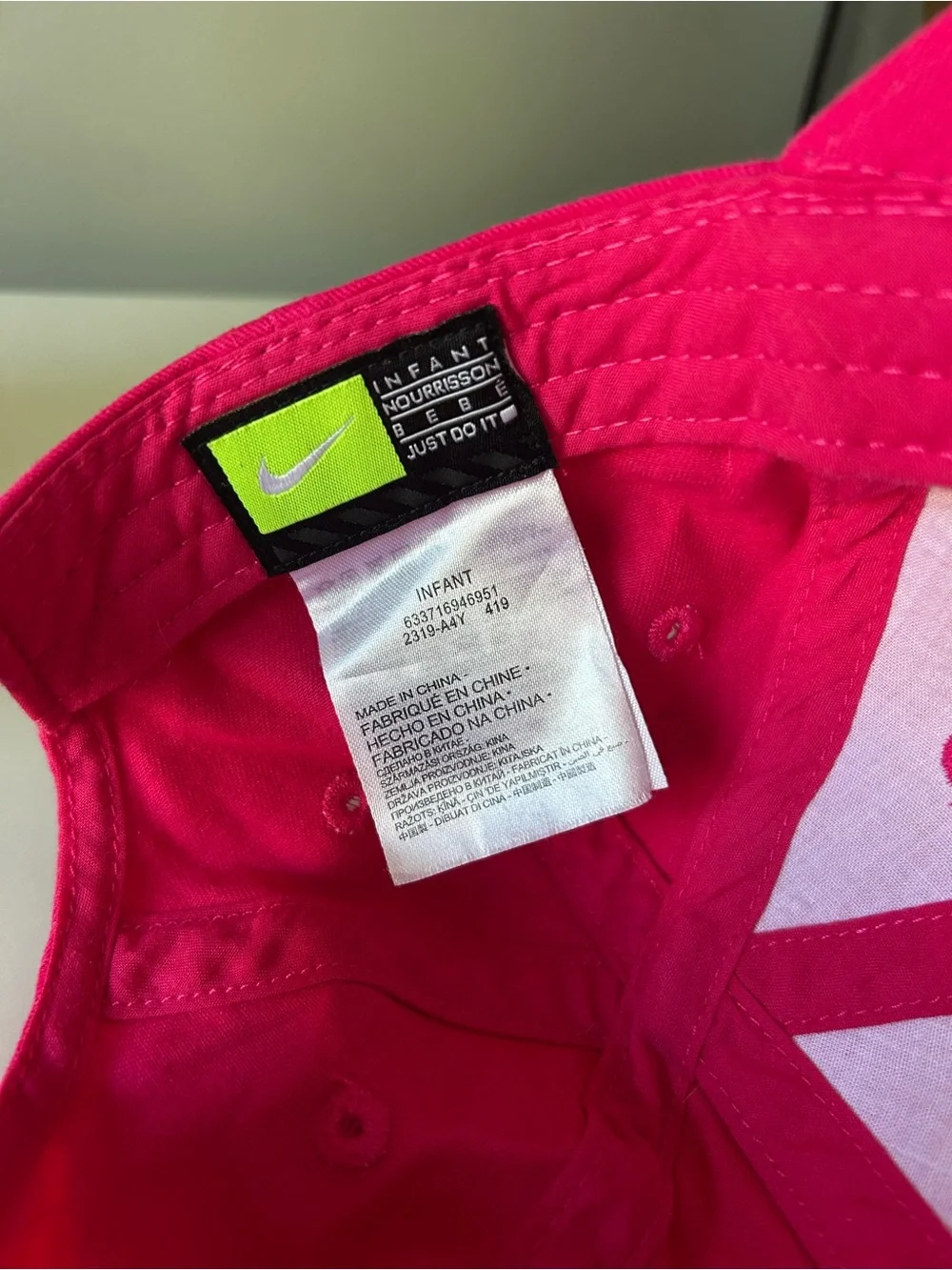 Infant hot pink with black Nike check baseball hate